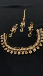 HOME “elegant black & gold crystal jewellery set – timeless grace for every occasion” free delivery all over pakistan 🚚 flash sale 🔥 limited stock 💯 link in bio about product⬇️ flash sale 🔥 limited stock 💯 this elegant black and gold jewellery set radiates timeless sophistication. the set includes a beautifully designed necklace, matching earrings, and a maang tikka, all adorned with dazzling white stones and deep black gemstones. the floral and leaf motifs add a graceful touch, while the intricate craftsmanship gives it a luxurious appeal. perfect for weddings, festive occasions, or evening events, this set enhances any outfit with its regal charm and classic allure.